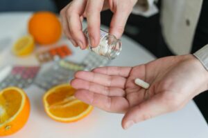 person taking oral peptides to optimise health